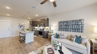 Located at 15915 Kingfield Dr in Houston, TX, this well-appointed one-bedroom, one-bathroom residence offers a thoughtfully designed open-concept floor plan across a single level. The living and kitchen areas flow seamlessly together, anchored by warm wood-look flooring and a ceiling fan that enhances airflow and comfort. Large sliding glass doors in the living room invite abundant natural light and provide an easy connection to the outdoors.

The kitchen is a standout feature, showcasing dark espresso cabinetry, granite countertops, a spacious center island with bar seating, and a full suite of stainless steel appliances. Stylish pendant lighting suspended above the island adds both functionality and a modern aesthetic touch.

The bedroom is a comfortable retreat, finished with the same wood-look flooring and neutral tones, with access to a walk-in closet outfitted with multi-tier wire shelving for generous storage. The full bathroom features granite countertops, dark cabinetry that mirrors the kitchen, and a soaking tub-shower combination with tile surround. A dedicated laundry area provides added convenience. The overall ambiance is clean, contemporary, and cohesive throughout.