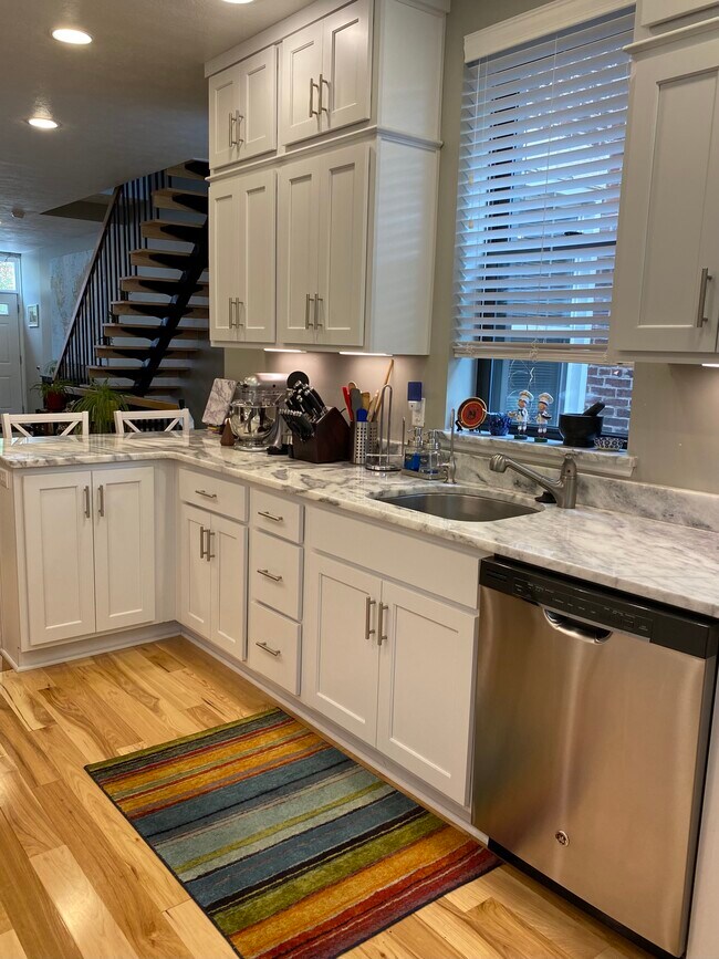 Beautiful updated kitchen with granite counters and stainless steel appliances - 5857 Pierce St