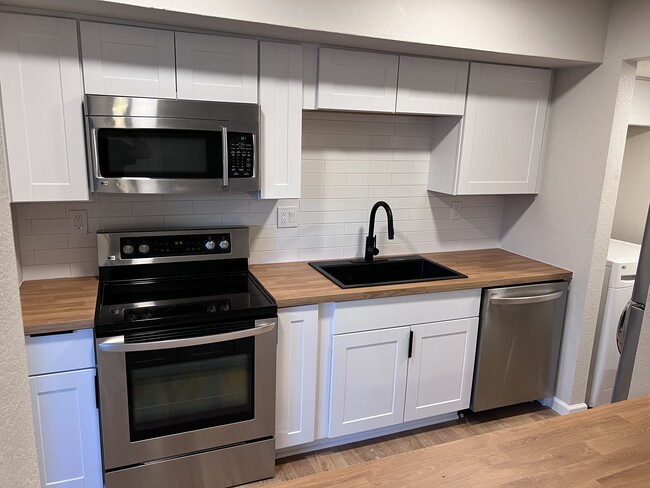 Updated kitchen with all stainless steel appliances - 7602 N 61st Ave