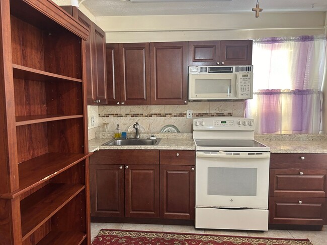 Building Photo - Furnished 1-Bedroom Apartment with Utiliti...