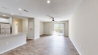 Located at 1900 Windsor Hill Dr in Matthews, NC, this 2-bedroom, 3-bathroom single-floor home offers a thoughtfully designed layout that maximizes comfort and functionality. The open-concept living room features light hardwood-style flooring, a ceiling fan, textured ceilings, and a sliding glass door that floods the space with natural light and provides direct access to a private patio with outdoor views.

The kitchen is well-appointed with white shaker cabinetry, granite-style countertops, stainless steel appliances including a gas range and refrigerator, a double sink, and recessed lighting. A breakfast bar peninsula connects the kitchen to the main living area, making it ideal for both cooking and entertaining.

Both bedrooms are carpeted and include ceiling fans or overhead lighting and windows with blinds that allow for natural light. The primary bedroom is generously sized and includes direct access to a private bathroom with a vanity featuring a stone-style countertop and an adjoining walk-in closet with built-in shelving. The bathrooms are clean and functional, with one featuring a full soaking tub and tiled surround. Additional spaces include a laundry area, utility room, and two hallways for seamless circulation throughout the home.