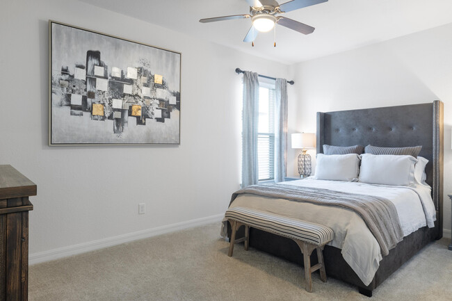 Experience tranquility in this elegantly designed bedroom, where comfort meets style. - Cortona South Tampa