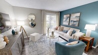 Located at 1740 Woodbrook Trail in Alabaster, Alabama, this 2-bedroom, 1-bathroom single-floor residence offers a thoughtfully designed layout across a comfortable footprint. The living room is a standout space, featuring wood-style flooring, a textured ceiling, a bold teal accent wall, and a sliding glass door that invites natural light and provides outdoor access. The adjacent dining area is anchored by a pendant light fixture and wood-style flooring, creating an inviting setting for meals. The galley-style kitchen is well-equipped with white shaker cabinetry, granite-style countertops, stainless steel appliances, and a skylight that brightens the workspace. The primary bedroom offers plush carpeting and direct access to the full bathroom, which features a white vanity with granite-style countertops, a large mirror, and wood-style flooring. The second bedroom is equally comfortable, also finished with soft carpeting. Two closets provide ample storage, complemented by a dedicated utility room. Neutral gray tones throughout create a cohesive, modern aesthetic, while the consistent use of wood-style flooring in common areas ties the space together seamlessly.