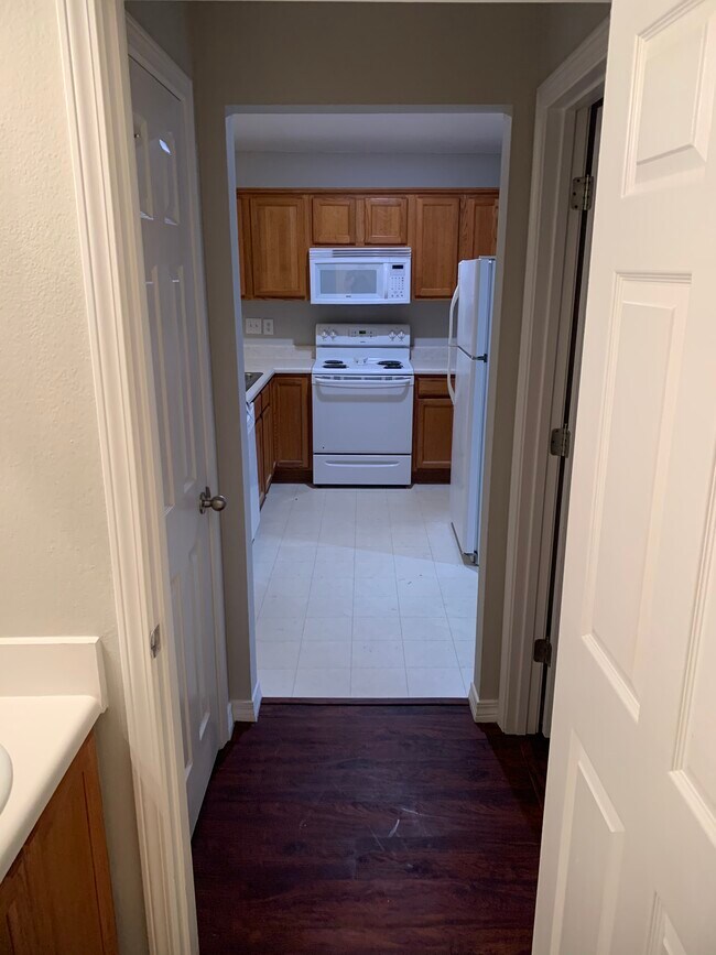Kitchen as seen from guest bathroom - 9731 Cobblebrook Dr