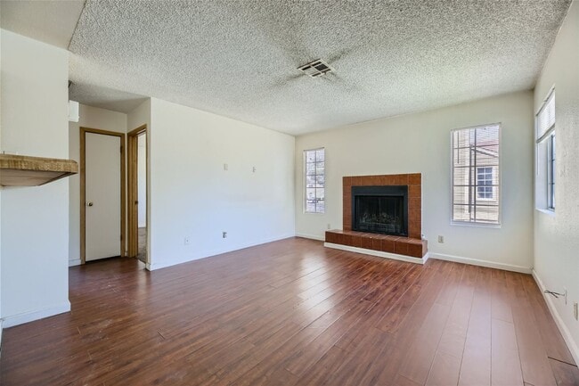 Building Photo - 2nd Story 2-Bed Condo with Tile Fireplace