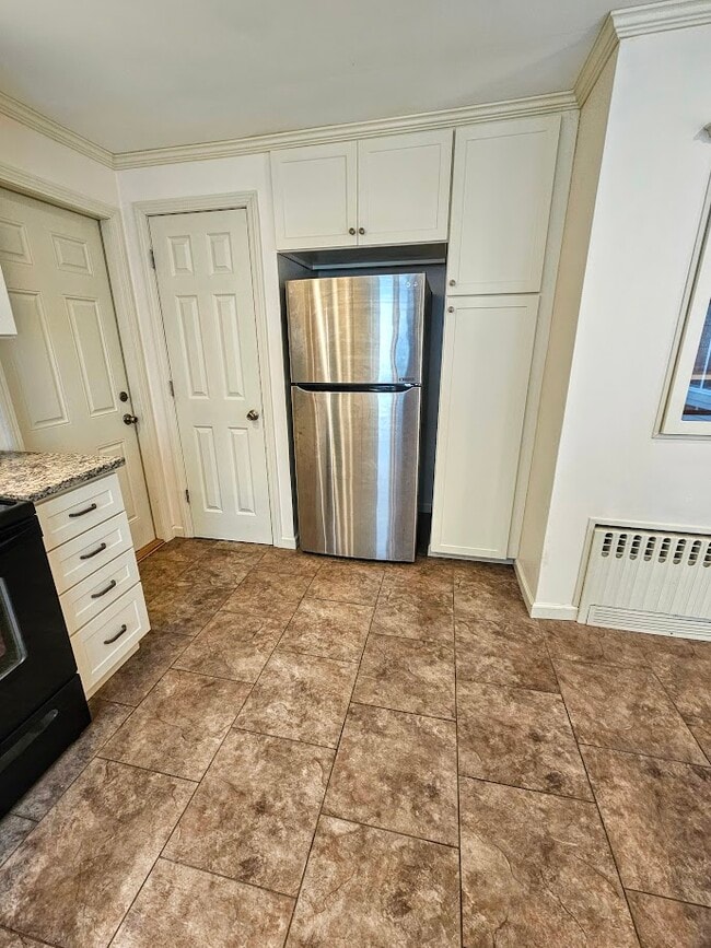 Refrigerator, cabinets, Tarkett floor, utility closet door - 30 Fairfield Ave