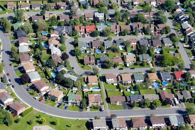 Aerial view of suburban homes and green spaces in Longueuil.