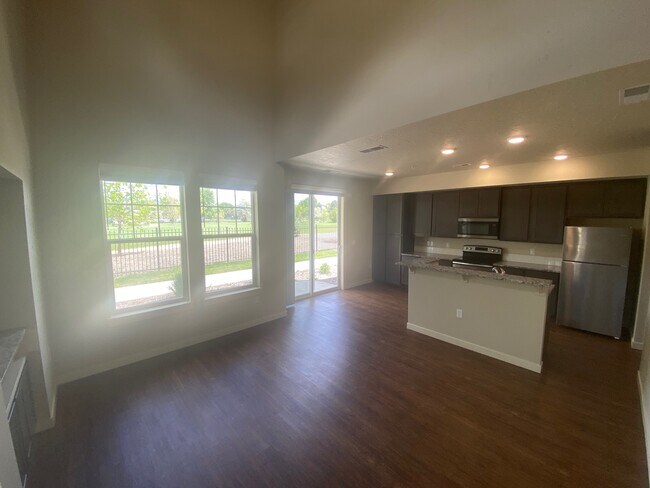 Kitchen, eating area, patio access - 7356 N Lucy Rose Ln