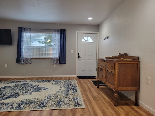 Living room with sideboard storage - 323 E 13th St