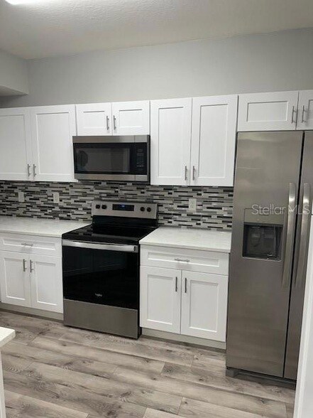 Building Photo - 5530 Metrowest Boulevard Unit 20