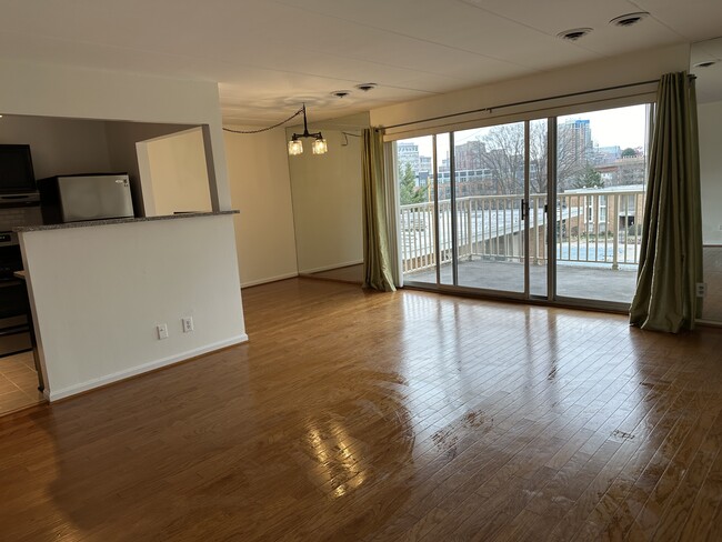 Sunny open floor-plan condo with wooden floors throughout. Freshly painted. - 2648 Redcoat Dr