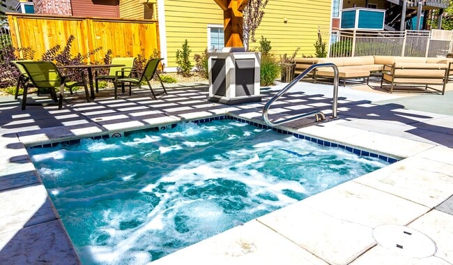 Unwind after a long day with a soothing soak in the hot tub. - Skyview Apartment Homes