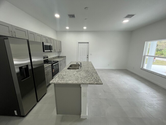 Building Photo - Brand New 1 Bed - 1 Bath - 1 Car Garage Gem in Desirable Lehigh Acres Location!