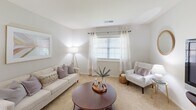 Located at 3300 Montavesta Rd in Lexington, KY, this single-floor residence offers a thoughtfully designed layout with two bedrooms, two bathrooms, and a well-defined separation of living spaces. The living room welcomes with neutral-toned carpet, soft natural light filtering through sheer-curtained windows, and an open sightline into the dining area, creating a connected yet organized flow. The dining room is a defined space with its own ceiling light fixture and convenient access to both the hallway and the entry closet. The kitchen is efficiently laid out with rich cherry-toned cabinetry, granite-style countertops, black appliances including a range and over-the-range microwave, a double stainless steel sink, and light wood-style flooring. The primary bedroom is a comfortable retreat featuring carpet flooring, a large window with sheer curtains, and ample natural light. The second bedroom is equally functional with a window and neutral finishes. Both bathrooms are well-equipped, with one featuring warm wood cabinetry, a large vanity mirror, and a bright light bar. Five closets throughout the residence provide exceptional storage. A connecting hallway links all rooms efficiently, completing a practical and livable floor plan.