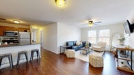 Located at 2714 Stratford Ave in Cincinnati's vibrant 45220 neighborhood, this single-floor, 3-bedroom, 2-bathroom home offers a well-designed layout that balances comfort and functionality. Rich hardwood-style flooring flows throughout the main living areas, anchoring the open-concept design.

The living room is bright and inviting, featuring a ceiling fan and multiple windows that draw in natural light and offer views of the surrounding neighborhood. Adjacent to it, the kitchen is efficiently designed with warm honey-toned cabinetry, dark granite countertops, stainless steel appliances, and a peninsula with bar seating — ideal for casual dining and entertaining.

A hallway connects the living areas to three well-proportioned bedrooms, each finished with plush carpeting and generous closet space with bi-fold doors. The primary bedroom provides a comfortable retreat with its own dedicated closet.

Both bathrooms are finished with large-format tile flooring, rich wood vanities topped with granite countertops, and shower-tub combinations with curtain enclosures. The home also features an impressive five closets throughout, ensuring abundant storage. Clean white walls and consistent finishes lend a cohesive, move-in-ready aesthetic throughout the entire space.