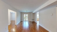 Located at 333 River Dr in Allentown, PA, this well-appointed 2-bedroom, 2-bathroom residence offers a comfortable and functional single-floor layout. Rich hardwood flooring flows consistently throughout the main living areas and bedrooms, lending warmth and cohesion to the space.

The spacious living room is bathed in natural light, enhanced by sliding glass doors that open onto a private balcony with outdoor views — an ideal spot for relaxing or entertaining. The open feel of this central gathering area is complemented by neutral wall tones and clean white trim.

The kitchen is thoughtfully appointed with warm wood cabinetry, granite countertops, and black appliances including a refrigerator and dishwasher. A window above the counter brings in additional natural light, making the space feel bright and inviting.

Both bedrooms are generously sized, with the primary bedroom offering a walk-in closet and direct access to one of the two bathrooms. The second bedroom features a bi-fold closet door providing ample storage. Each bedroom continues the hardwood flooring found throughout the home.

The two bathrooms are finished with light tile flooring and full tub-shower combinations with tile surround accents, offering clean and functional design. Multiple closets and hallways throughout the layout contribute to excellent overall storage and ease of circulation.