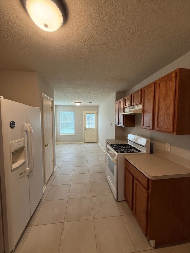 Foto del edificio - 5010 Woodland Meadows Ln