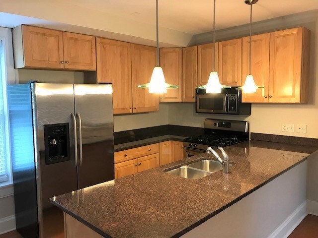 Kitchen with stainless steel appliances - 5934 Elwood St