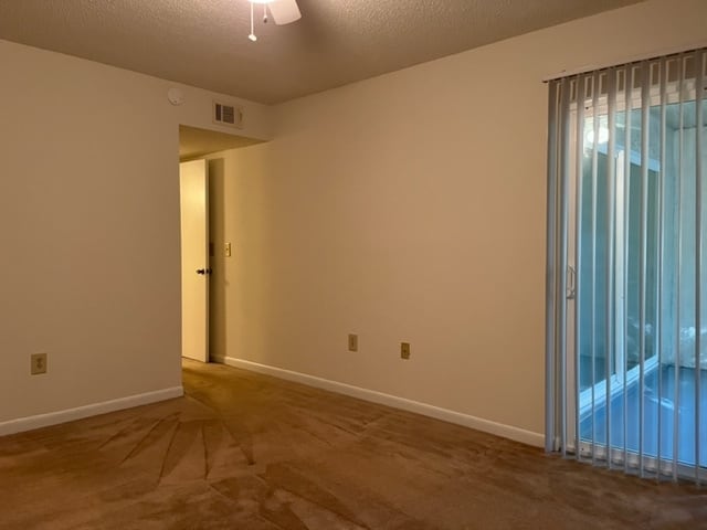 1/1 primary bedroom 2 - Creekwood Apartments