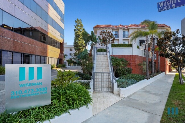 Sidewalk View of McClellan Corner - McClellan Corner by Wiseman