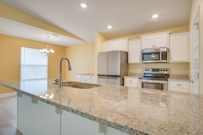 Building Photo - Modern Living in Commander's Cove - 3BR, Granite Counters & Military Deposit Special