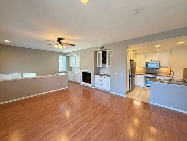 Building Photo - Sleek 2-Bed with a Den/Office + Flex Corner Condo with Attached Tandem Garage