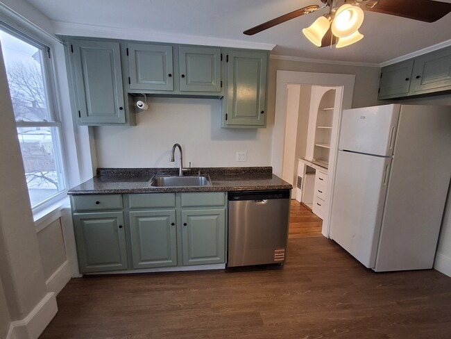 Kitchen features brand-new vinyl plank flooring and dishwasher. - 13 Mulberry St