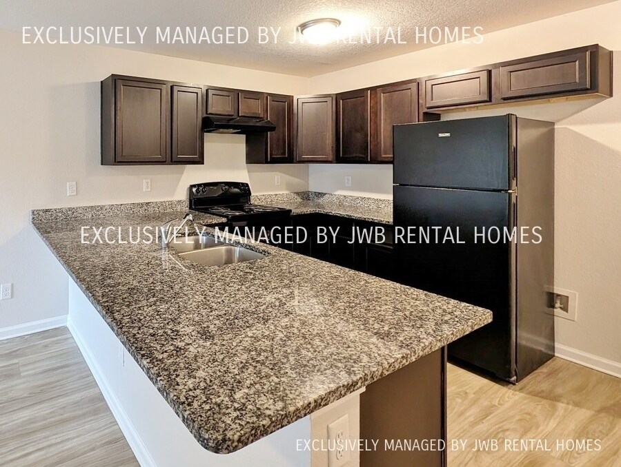 Building Photo - 8509 McGirts Village Ln