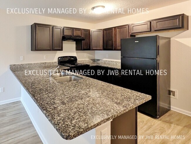 Building Photo - 8509 McGirts Village Ln