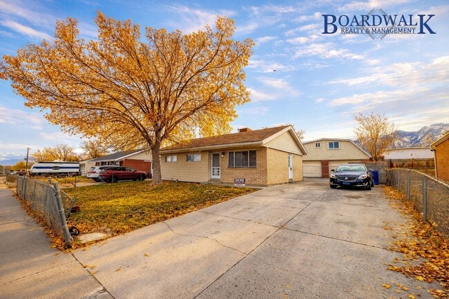 Building Photo - Spacious 5-Bedroom Home with Lofted Garage