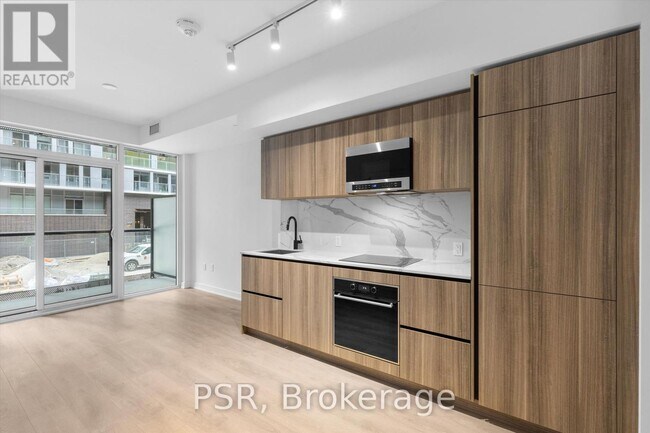 Photo du bâtiment - 117-117 Broadway Ave