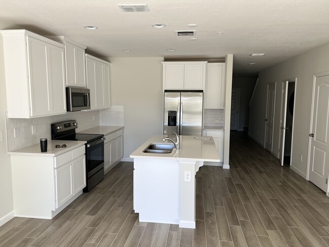 kitchen with brand new appliances - 493 Cape Honeysuckle Pl