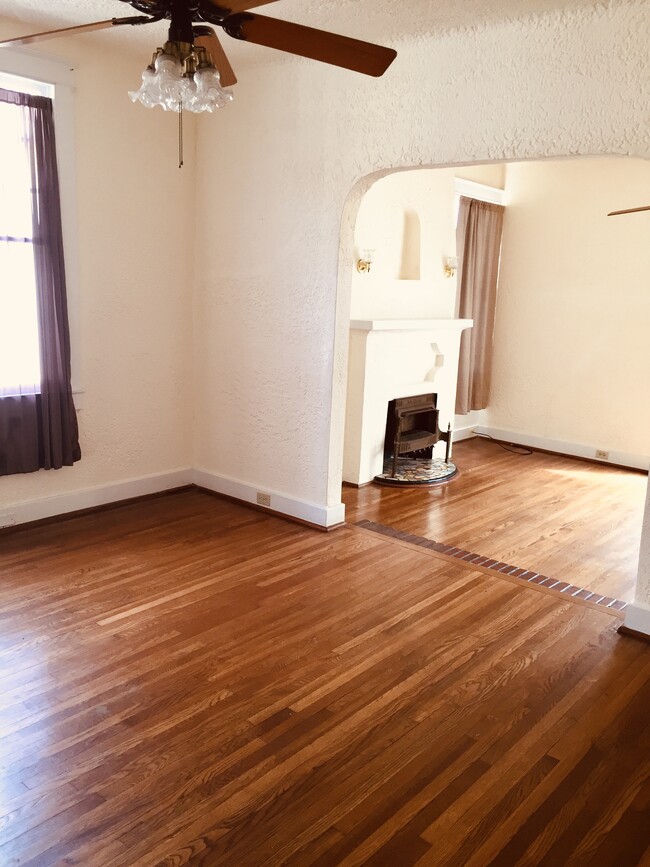 D/R looking into L/R - light with original hardwood floors - 3808 State St Dr