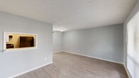 This well-appointed one-bedroom, two-bathroom single-story unit at 670 Maxey Rd in Houston, TX offers a clean, updated interior with a practical and efficient layout. Light gray walls and textured ceilings carry throughout the home, complemented by durable wood-look luxury vinyl plank flooring that extends seamlessly across the living areas and bedroom.

The living room is a bright, open space anchored by a large front-facing window that fills the room with natural light. A distinctive pass-through window connects the living area to the kitchen, enhancing the open feel. The kitchen is equipped with white cabinetry, white countertops, a double stainless steel sink, and a stainless steel dishwasher, alongside a dedicated pantry for added storage.

The bedroom offers comfortable proportions, a ceiling fan with light fixture, a large closet, and a window with natural light. The unit includes two full bathrooms, each featuring a tub-shower combination, white vanity with single sink, and a well-lit mirror. Three closets throughout the unit provide ample storage. A connecting hallway ties the layout together efficiently, completing this compact yet functional home.