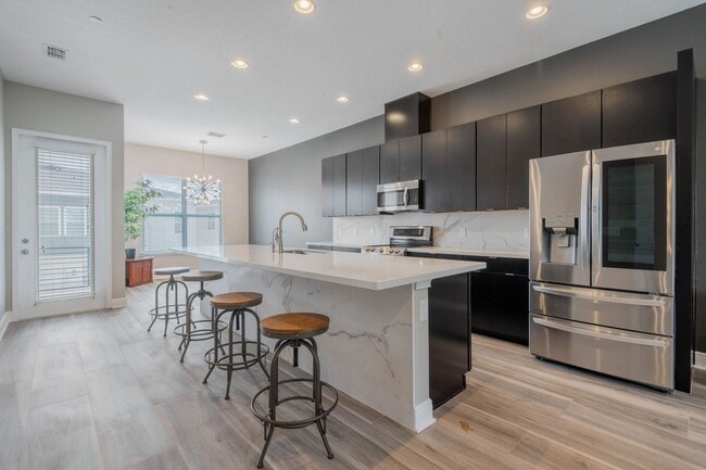 Building Photo - AMAZING 4/3.5/2 Laureate Park Townhome wit...