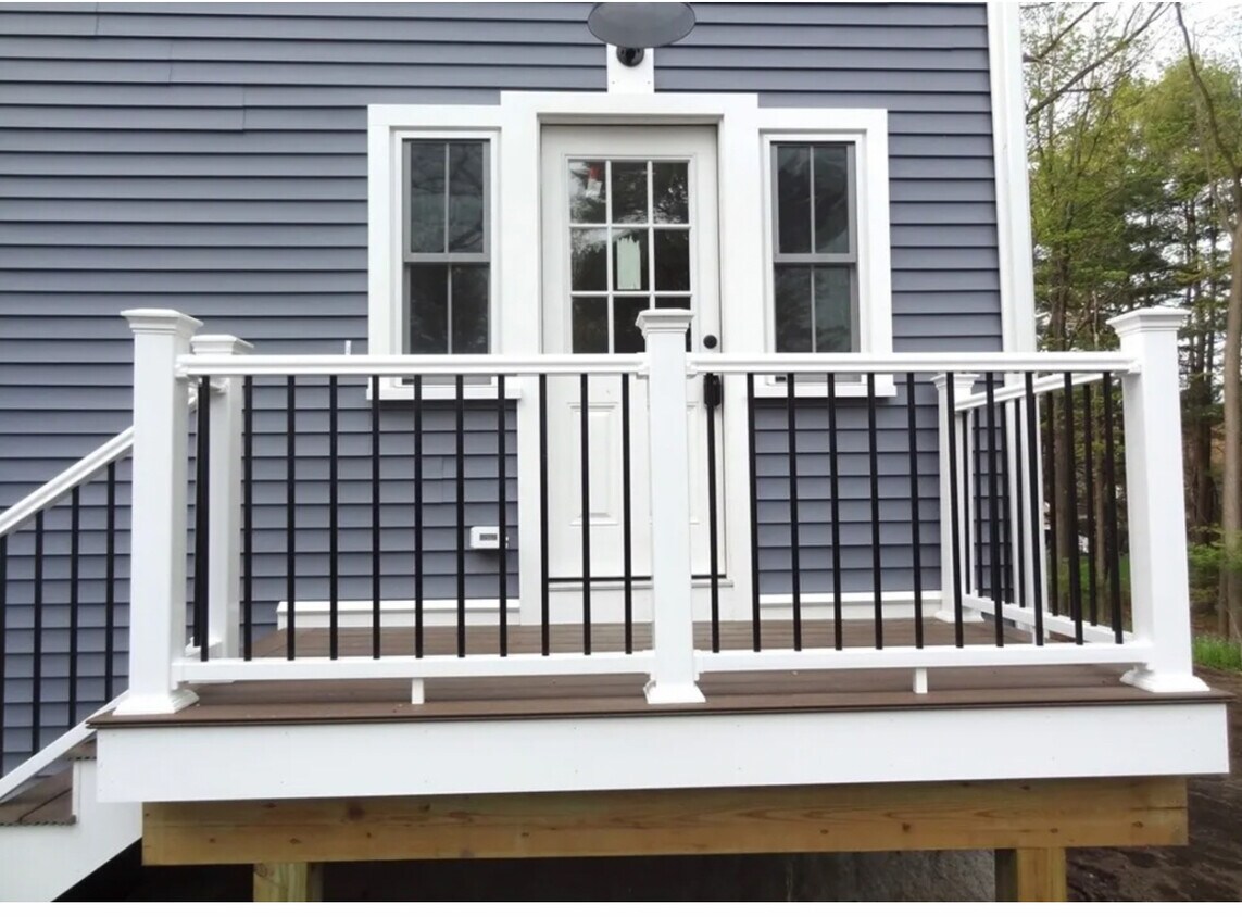 Designated front entrance with two parking spaces and nice yard for bbq-ing. - 81 Pleasant St
