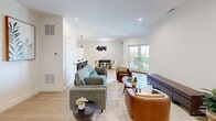 Unit 407 at 505 South St in Peekskill, NY offers a thoughtfully designed, modern residence with 2 bedrooms, 2 bathrooms, a dedicated office, and generous living space spread across a single floor. Light-toned hardwood flooring flows throughout, complementing a clean, contemporary aesthetic defined by crisp white walls and recessed lighting.

The open-concept living, dining, and kitchen area forms the heart of the home. The kitchen features white shaker cabinetry, stainless steel appliances, a wood-toned island with a white quartz countertop, and pendant lighting — ideal for both everyday cooking and entertaining. The dining area sits adjacent, bathed in natural light from large windows, while the living room opens to a private balcony through French doors, revealing stunning panoramic views of the Hudson River and the surrounding Peekskill landscape.

The spacious primary bedroom offers ample natural light, while the second bedroom provides a comfortable retreat. A dedicated office with recessed lighting offers a quiet, functional workspace. Both bathrooms are finished with neutral tile flooring and modern vanities. A closet provides additional storage. The balcony, with its expansive river and hillside views, serves as a standout feature, elevating the overall living experience of this well-appointed residence.