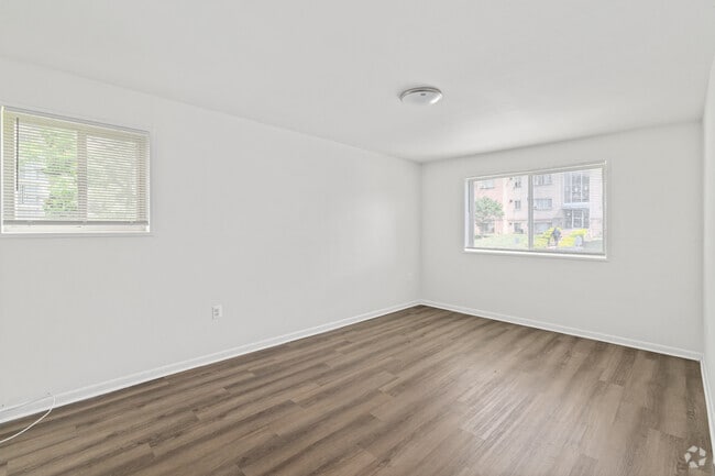 2BR, 1BA - 900SF - Primary Bedroom - Queens Park Plaza Apartments