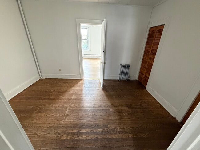 Room between kitchen and bedroom with large closets - 147 Ferry St
