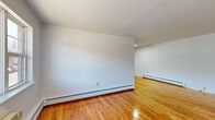 Located at 25 US-46 W in Lodi, NJ, this one-bedroom, one-bathroom unit offers a well-organized, single-floor layout designed for comfortable everyday living. Warm hardwood floors extend throughout the main living areas, reflecting natural light and lending a cohesive, inviting feel to the space.

The living room is generously proportioned, with clean white walls, baseboard heating, and a window that brings in natural light and exterior views. It flows naturally into a dedicated dining room, providing a clear separation between lounging and dining areas. A hallway connects the main living spaces to the private quarters.

The kitchen is efficiently laid out with warm-toned wood cabinetry, dark granite-style countertops, and a full suite of stainless steel appliances including a gas range, dishwasher, and refrigerator. Light vinyl plank flooring and a window above the sink add brightness to the cooking space.

The bedroom is a comfortable, well-sized room featuring a double-door closet and hardwood flooring, with additional natural light from a window. The unit also includes five closets in total, offering exceptional storage capacity throughout.

The bathroom features tile flooring, a tub/shower combo with tiled surround, a white vanity with storage, and a mirrored medicine cabinet — clean and functional in design.