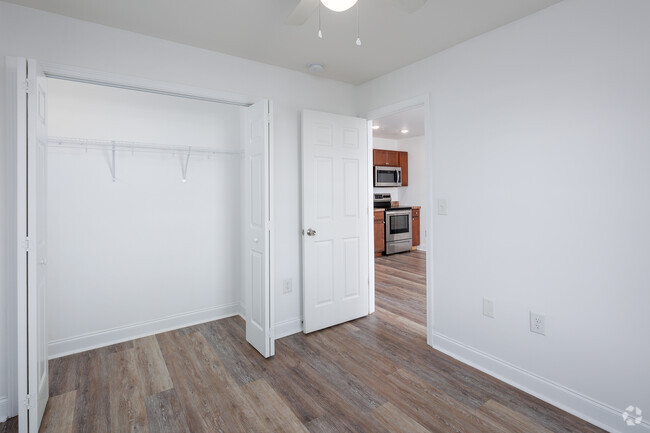 Bedroom 1 showing closet and kitchen. - Hemingway Apartments