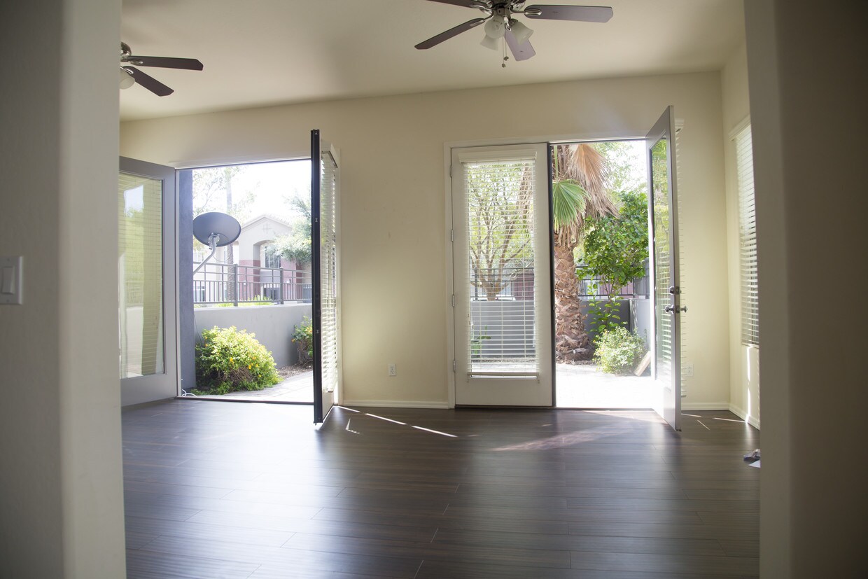 Large living room opens to private backyard - 300 N Gila Springs Blvd