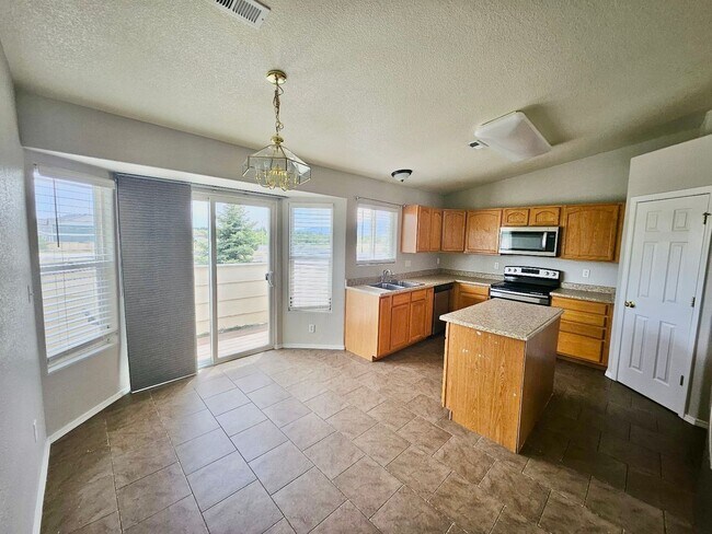 Building Photo - Spacious 3 Bedroom Condo Close to Peterson...