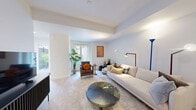 Located at 31 Farmstead Road in Toronto, this well-appointed 2-bedroom, 3-bathroom unit offers a thoughtfully designed single-floor layout with a clean, modern aesthetic throughout. Light wood-toned flooring flows seamlessly across all rooms, creating a cohesive and bright interior.

The kitchen is a functional standout, featuring sleek white cabinetry extending to the ceiling, stainless steel appliances including a full-size refrigerator, built-in microwave, and range, complemented by a white countertop island that doubles as a breakfast bar. The open-concept living room is spacious and well-lit, with a window at the far end and ample room for both a seating and entertainment area.

The primary bedroom is a comfortable retreat with a window providing natural light, light-toned flooring, and clean white walls. The second bedroom offers closet storage and a similarly bright, neutral finish. Both spaces benefit from a calm, minimal design language.

The three bathrooms are finished in crisp white tile with tub-shower combinations and contemporary fixtures. Additional highlights include a dedicated entrance foyer and a closet for storage. The overall ambiance is fresh, modern, and move-in ready — well-suited for those seeking a stylish and practical home in Toronto.
