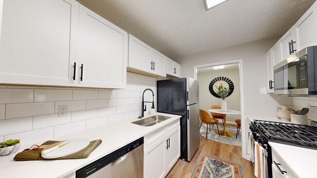 Newly Renovated Kitchen with Quartz Countertops - Rosemont at East Cobb Apartments