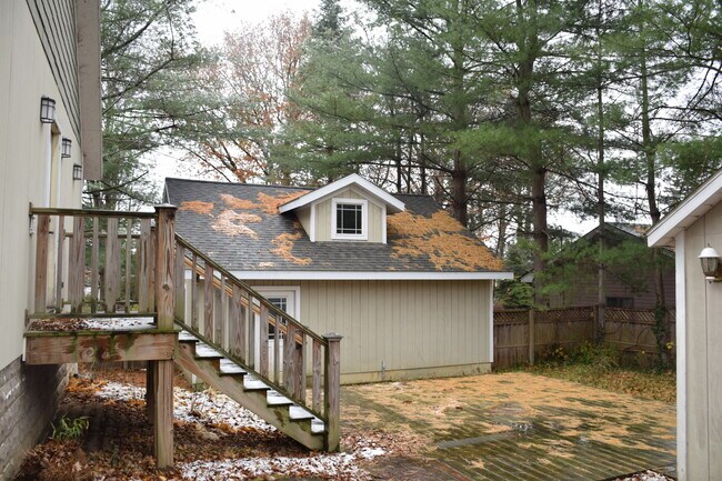 Back of house with view of garage - 67 Union St