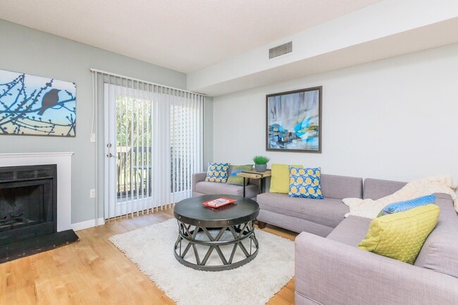 Living Room With Wood-Burning Fireplace - Waterford Village