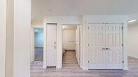 Located at 4800 B St in Springfield, Oregon, this single-floor, 2-bedroom, 2-bathroom home offers a clean and functional layout with modern finishes throughout. The kitchen is a standout feature, equipped with white shaker-style cabinetry, granite-look countertops, and black Whirlpool appliances including a refrigerator, electric range, and dishwasher. Light wood-style vinyl plank flooring runs through the kitchen and living areas, lending a bright, cohesive feel to the space. The open living room receives natural light through a window with blinds and includes a wall-mounted AC unit for climate control. Both bedrooms are carpeted and feature windows that allow in natural light, with views of the surrounding community. The primary bedroom includes a sliding-door closet and an in-wall heater. Each bathroom is finished with wood-look vinyl flooring, white cabinetry with granite-look countertops, and efficient fixtures; one bathroom features a walk-in shower, while the other includes a grab bar for accessibility. The overall aesthetic is clean, neutral, and move-in ready, making this home a practical and comfortable option in the Springfield area.