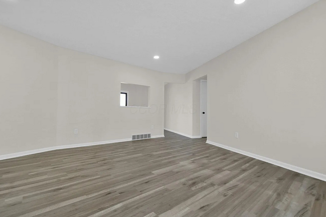 Living room has a window to the dining room! - 1670 Rainbow Dr NE