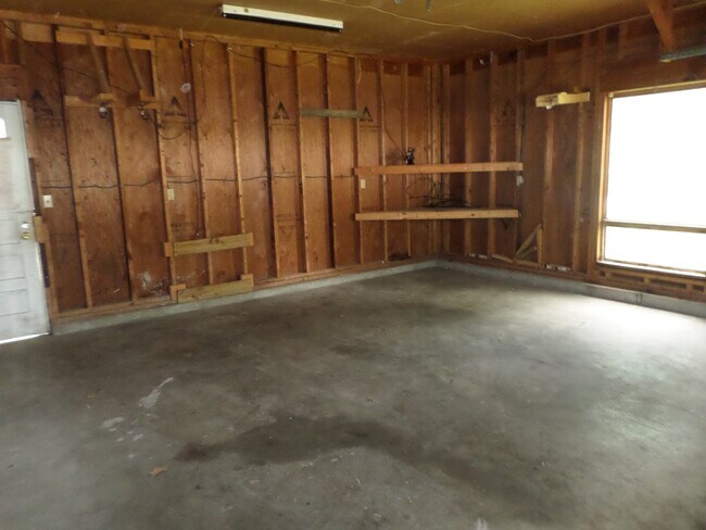 Building Photo - Privacy Fence and a Garage!